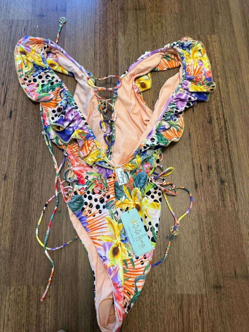 Luli Fama open sides one piece body suit